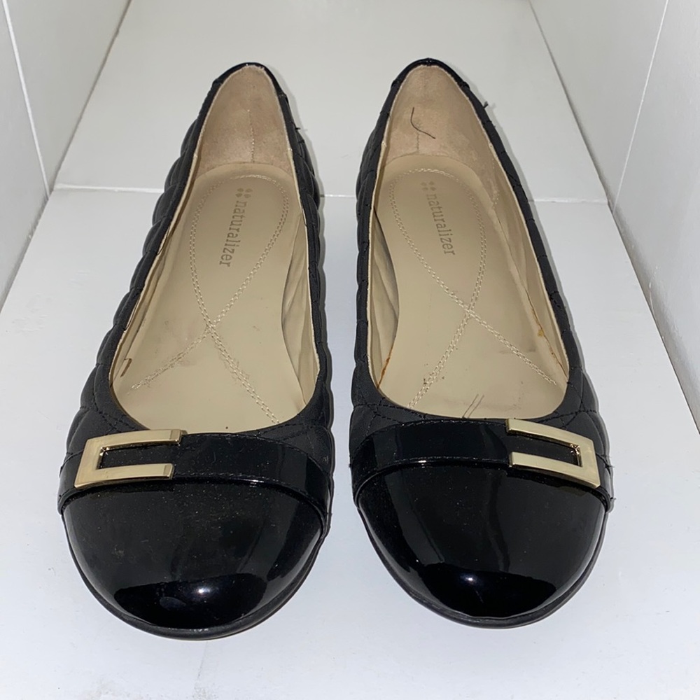 New, never worn. Black comfort flats with gold detail